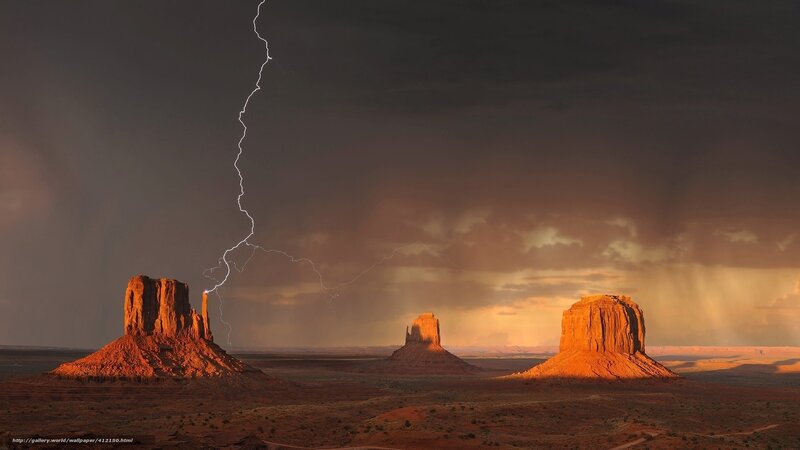 Lightning over desert rock formations