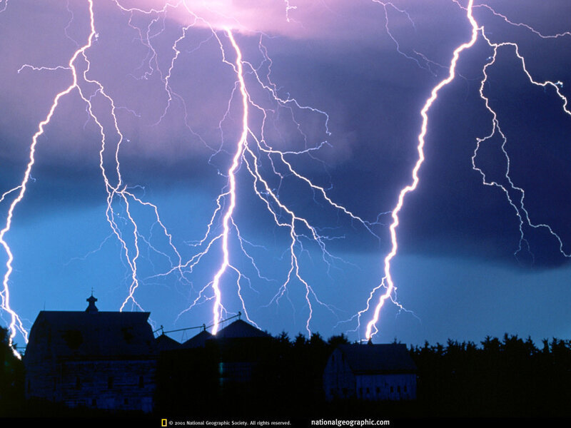 Lightning over farm buildings