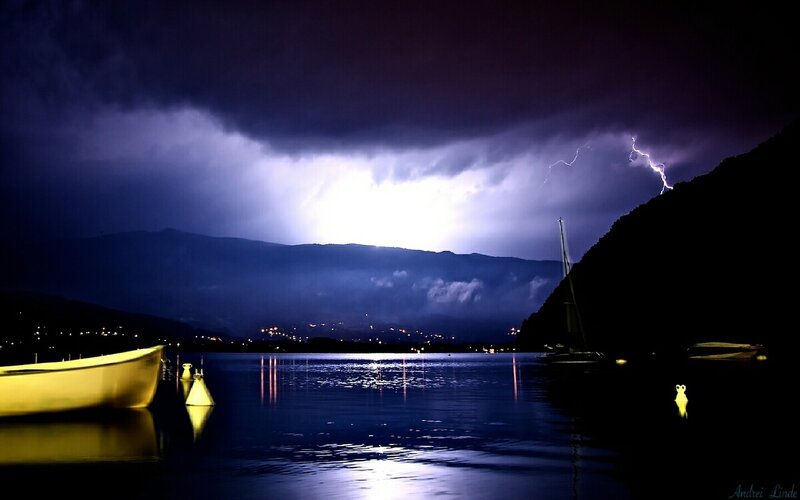 Lightning over Lake — Blue, Dramatic, Night, Photograph, Mountains, Boat