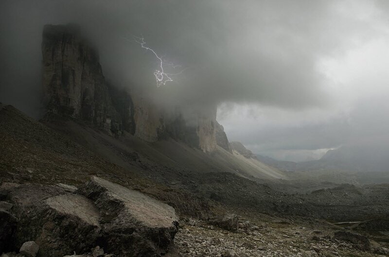 Lightning over mountain cliffs