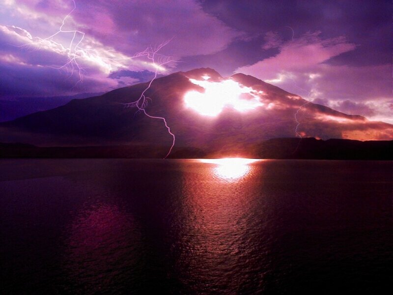 Lightning over mountain lake