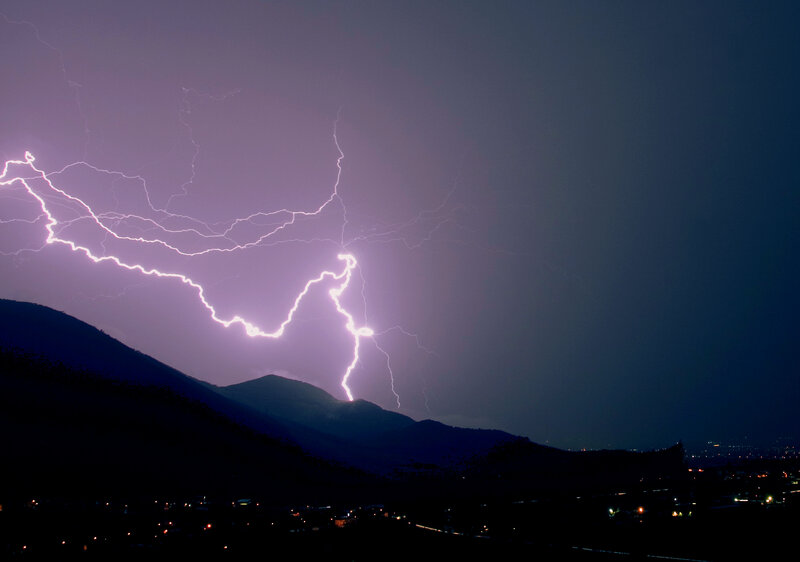 Lightning over mountain silhouette