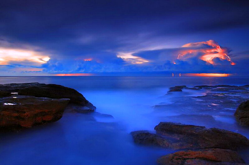 Lightning over Ocean — Blue, Dramatic, Night, Photograph, Clouds, Rocks