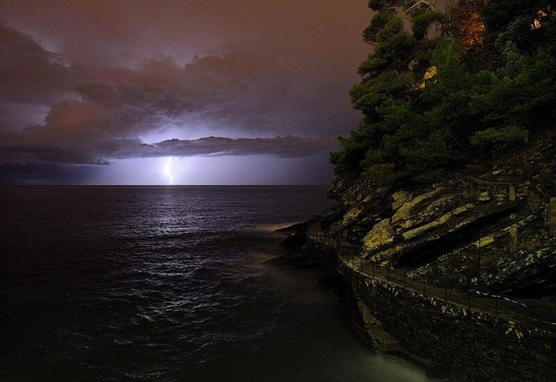 Lightning over Ocean — Dark Blue