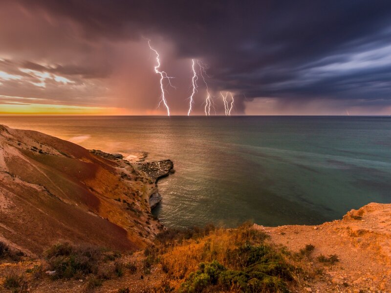 Lightning over Ocean — Orange, Dramatic