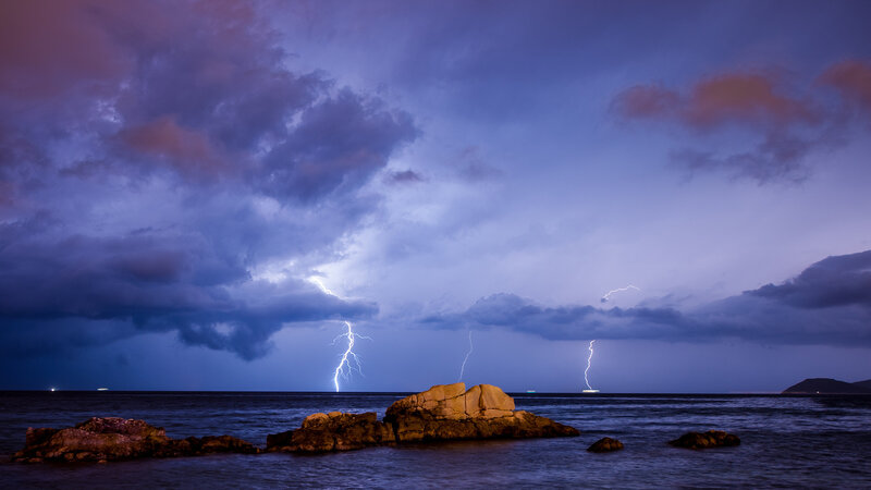 Lightning over Ocean — Purple, Dramatic, Night, Photograph, Clouds, Rocks