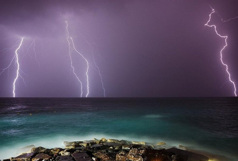 Lightning over Ocean — Purple, Dramatic, Night, Photograph, Rocks