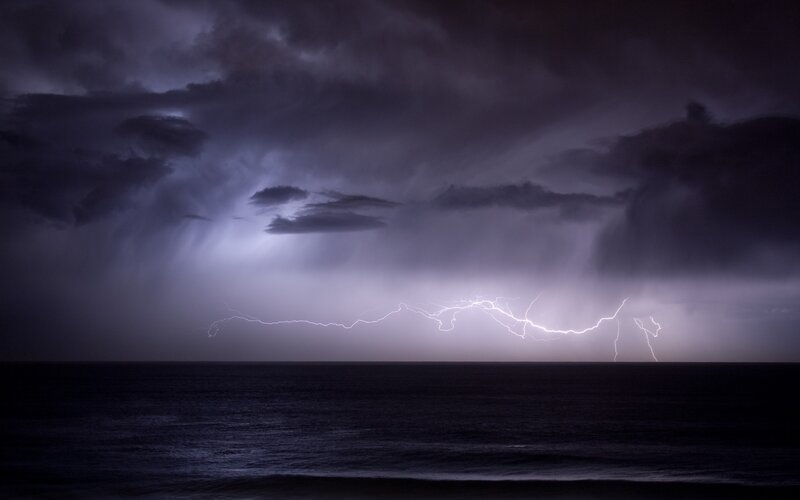 Lightning over Ocean — Purple, Dramatic, Night, Photograph, Storm Clouds, Black, White