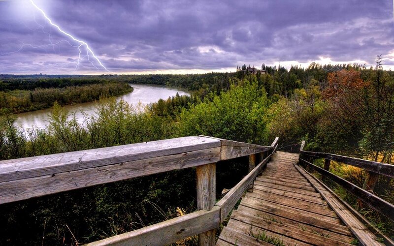 Lightning over river viewing platform