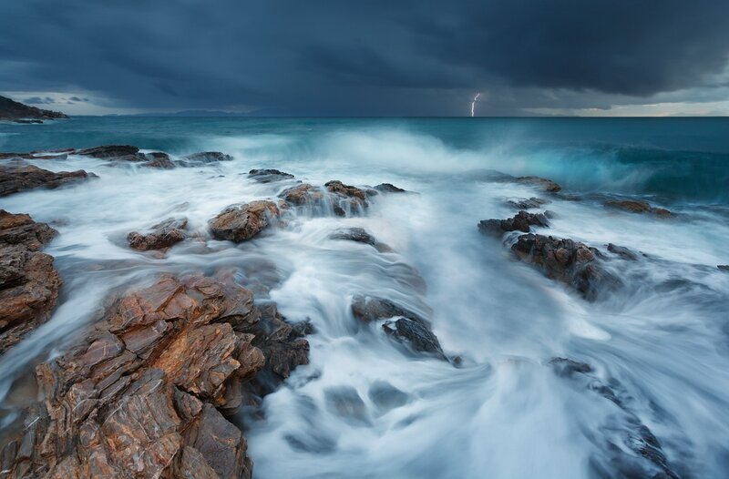 Lightning over Rocky Shore — Blue, Dramatic, Night