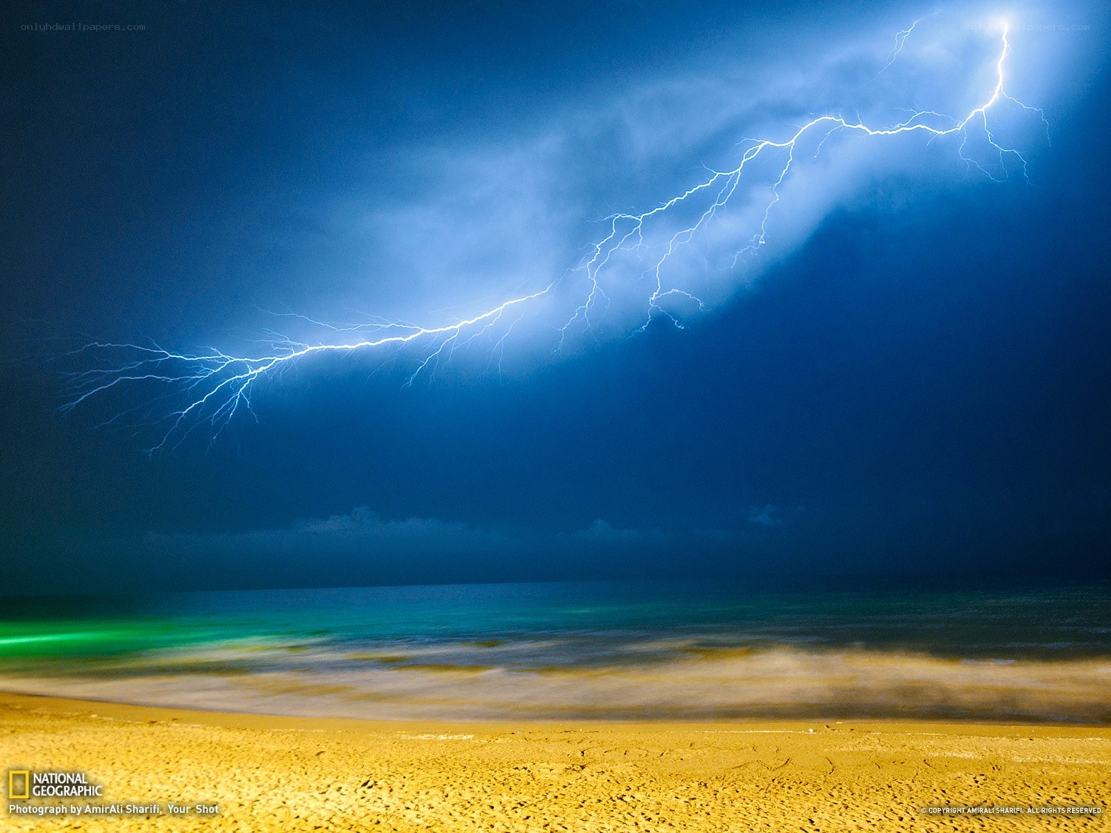 Lightning over the beach at night