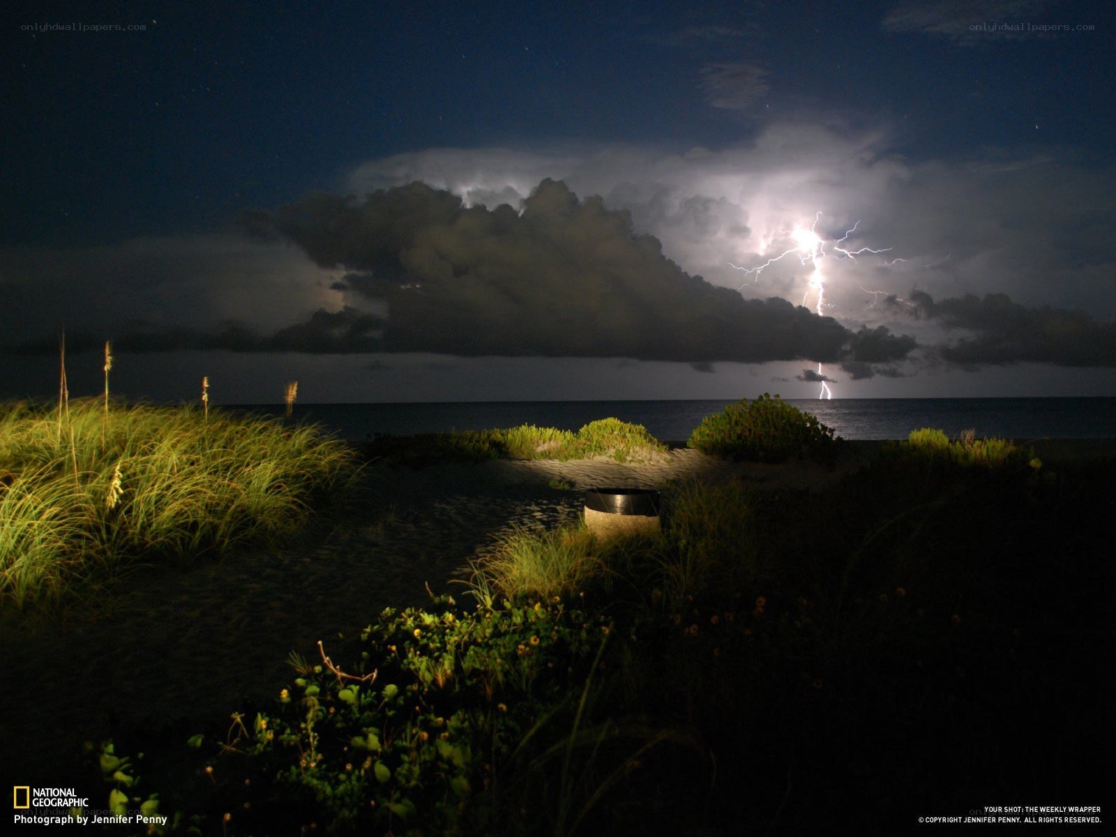 Lightning over the beach at night