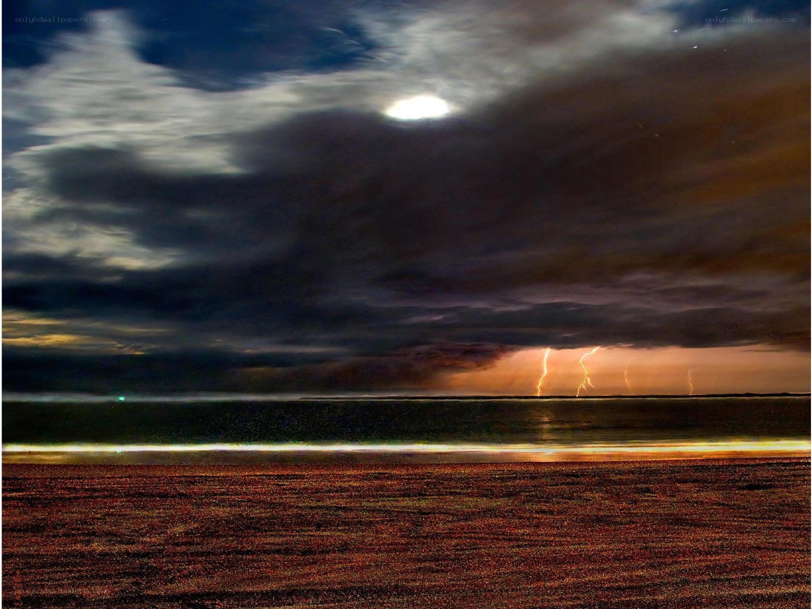 Lightning over the ocean at night