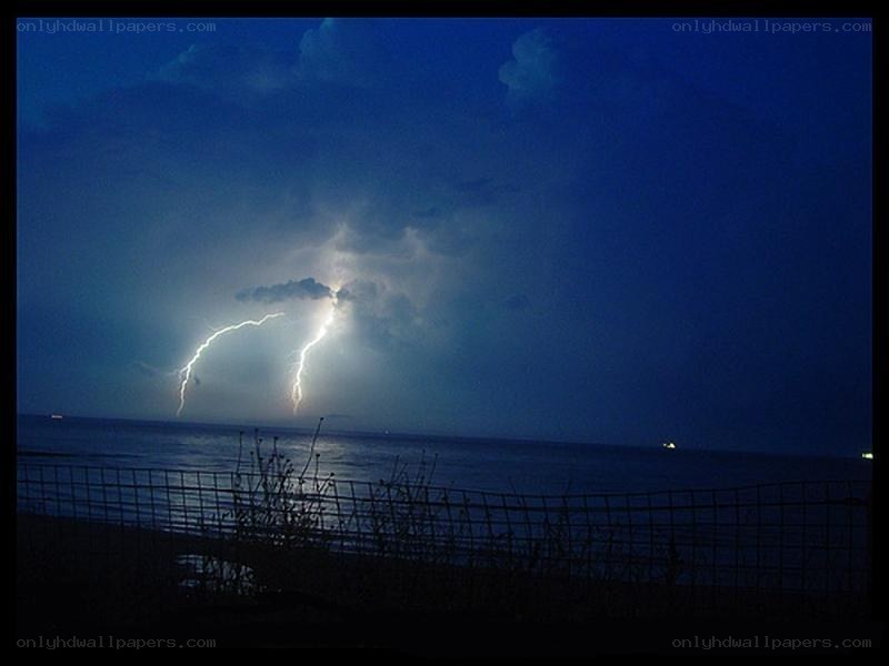 Lightning over the ocean at night