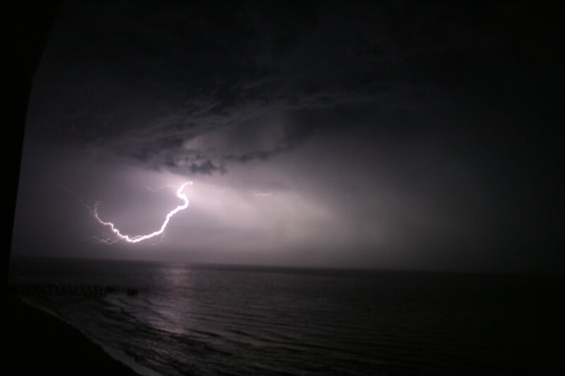 Lightning over the ocean at night