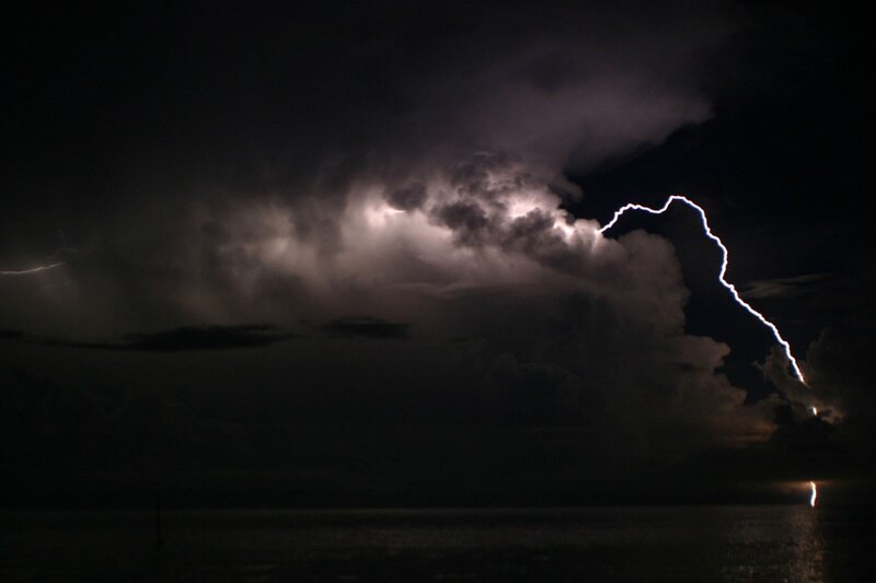 Lightning over the ocean at night