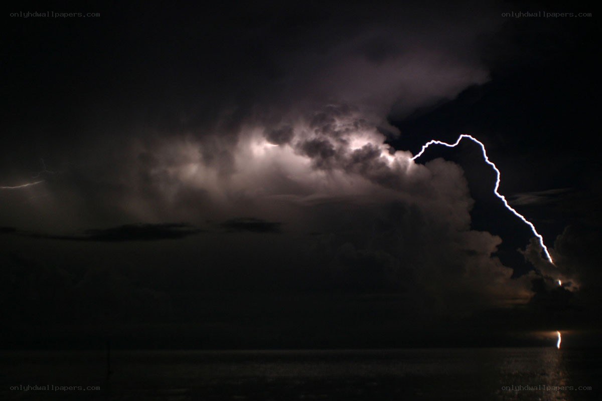 Lightning over the ocean at night