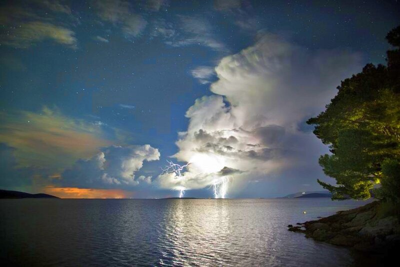 Lightning over Water — Blue, Dramatic, Night, Photograph, Clouds, Trees