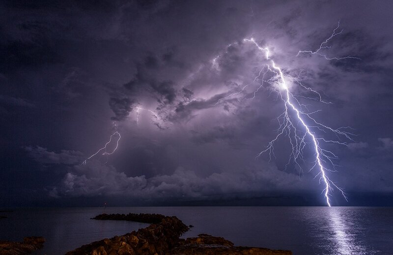 Lightning over Water — Purple, Dramatic, Night, Photograph, Clouds, Ocean, Rocks