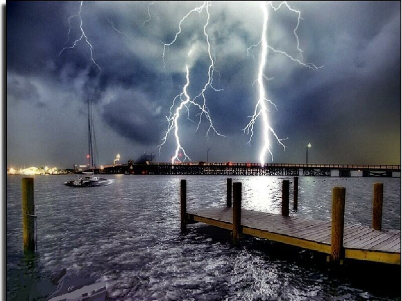 Lightning storm over a harbor