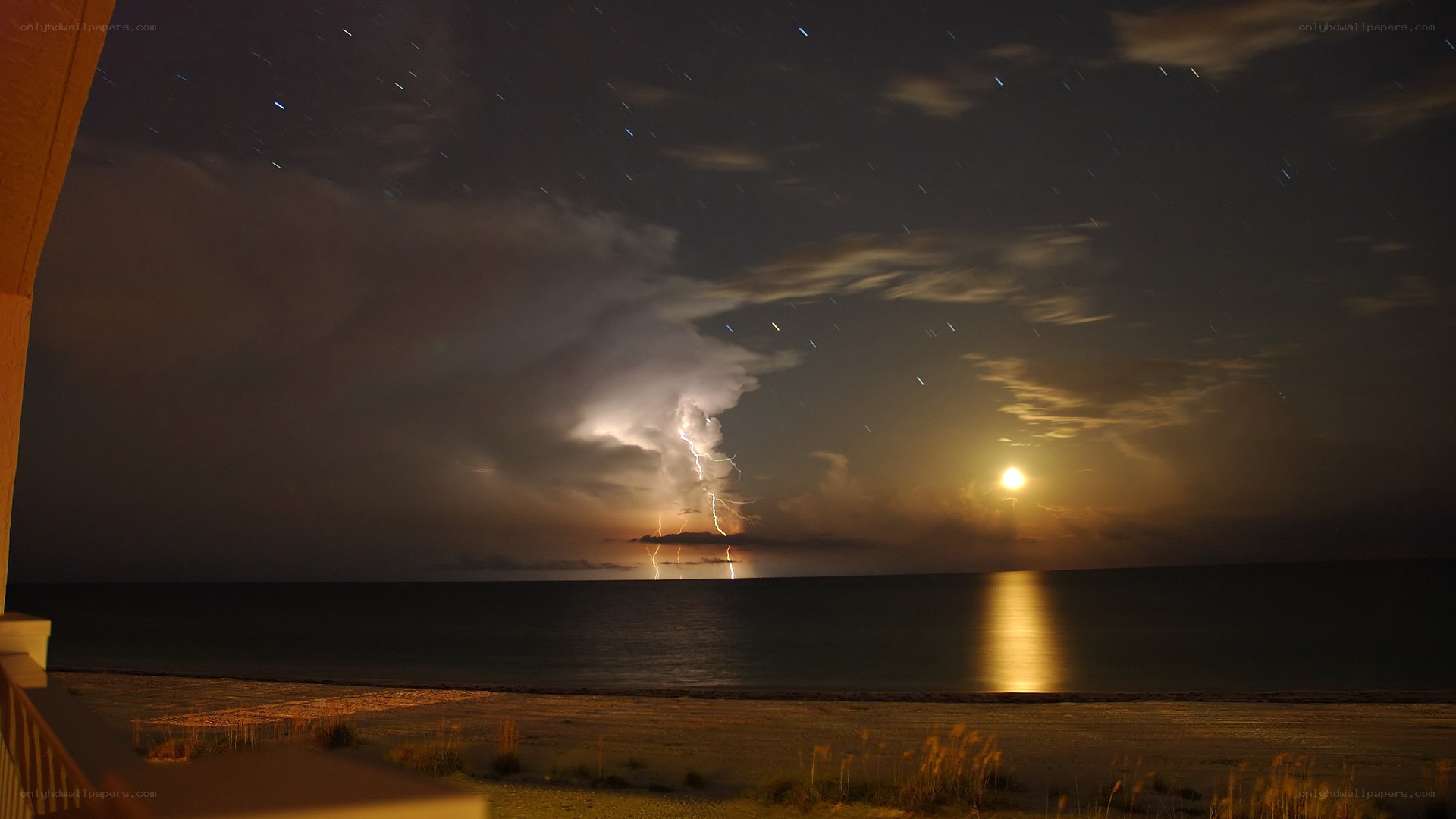 Lightning storm over beach at night