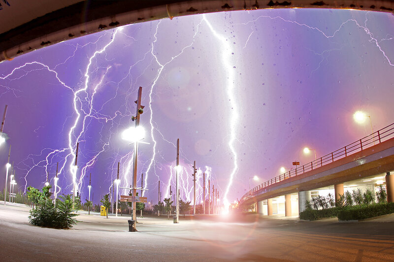 Lightning storm over city street