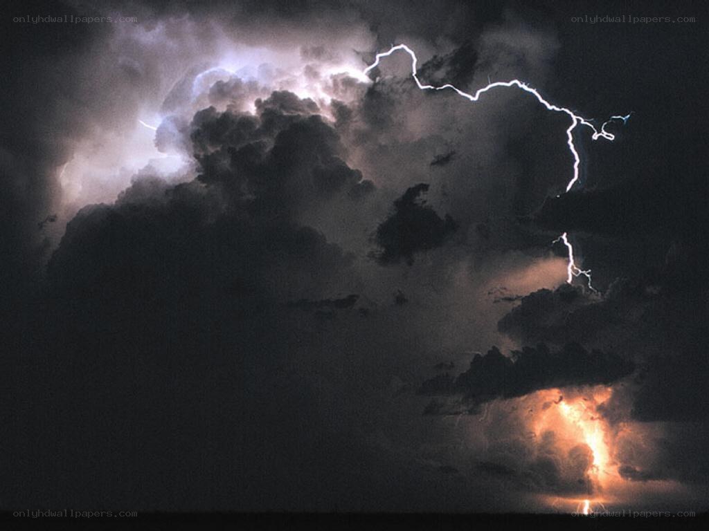 Lightning storm over dark clouds