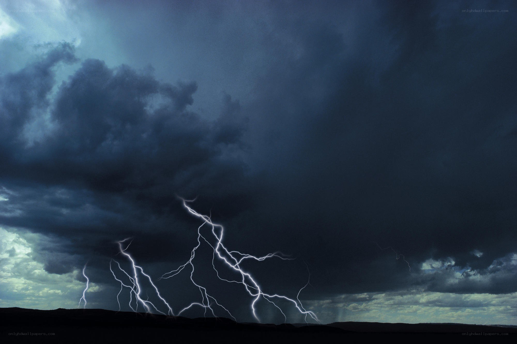 Lightning storm over dark landscape