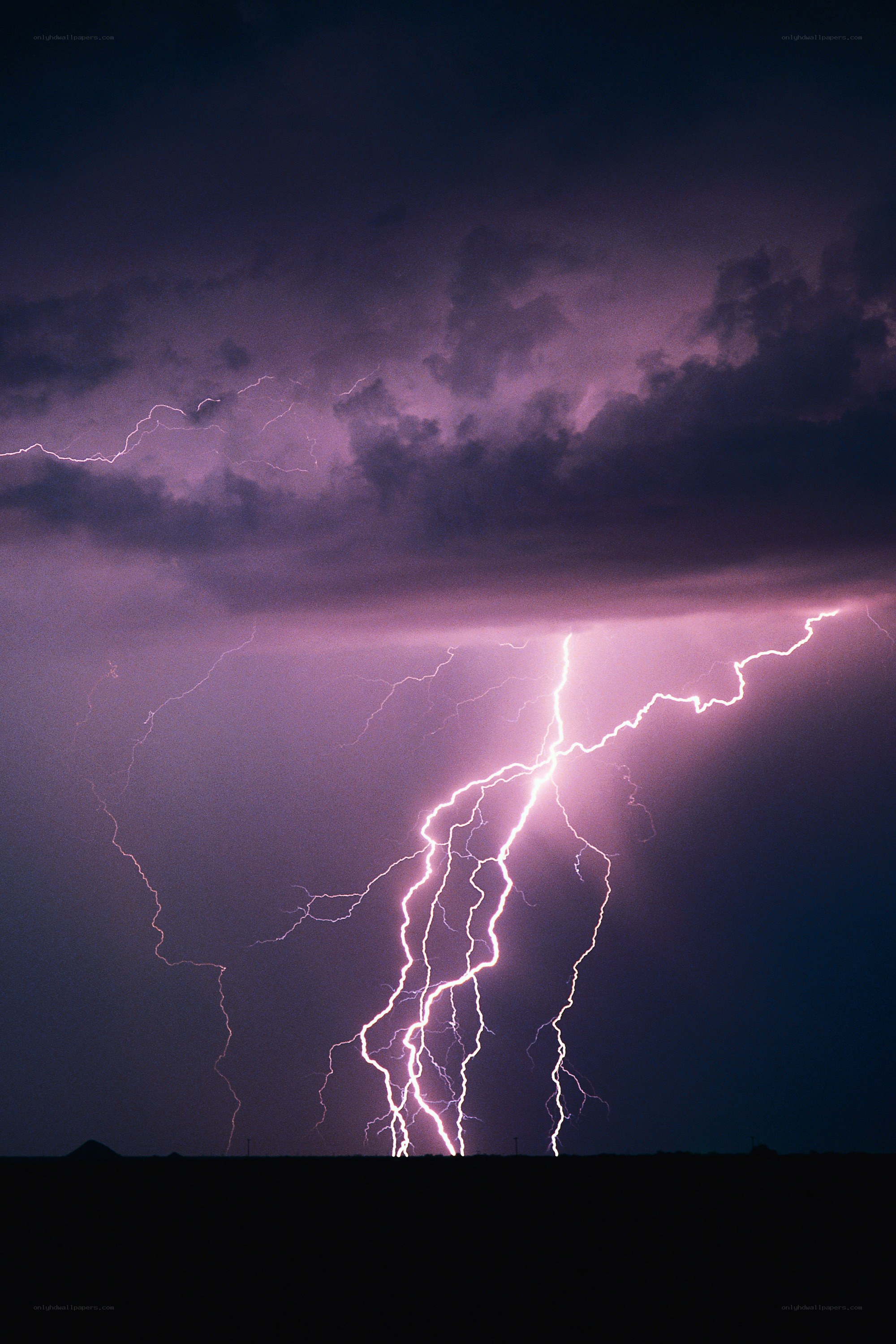 Lightning storm over dark landscape