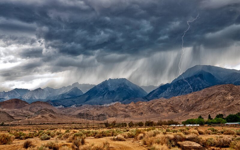 Lightning storm over desert mountains