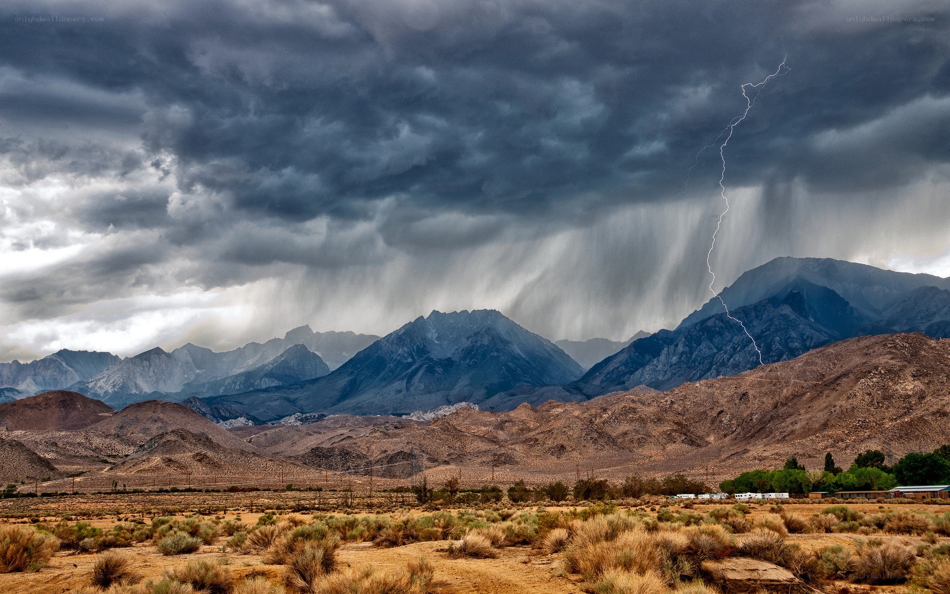 Lightning storm over desert mountains