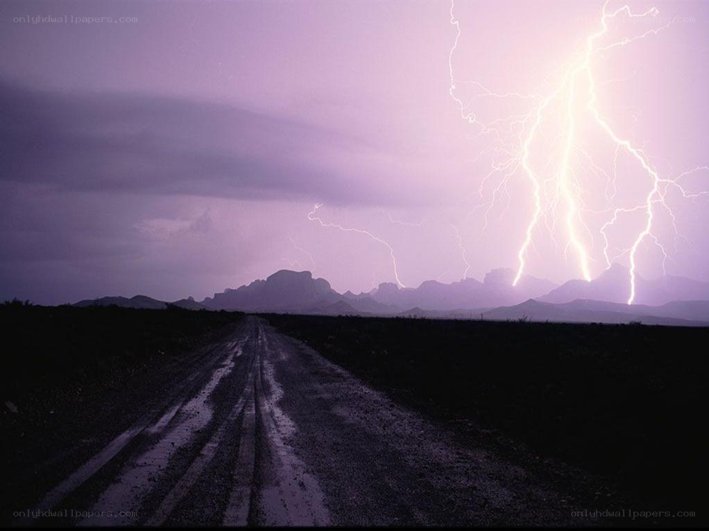 Lightning storm over desert road