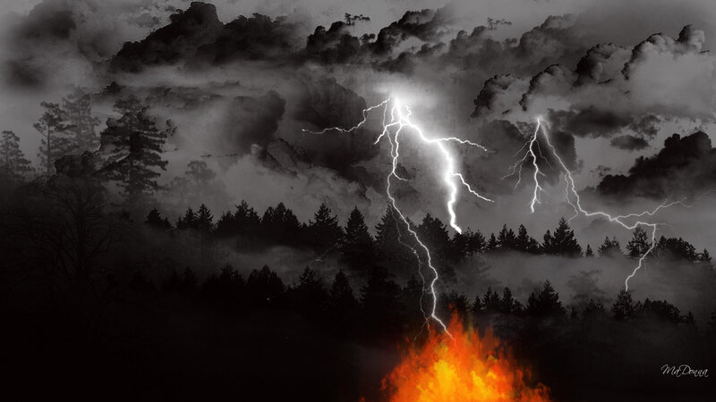 Lightning storm over forest fire