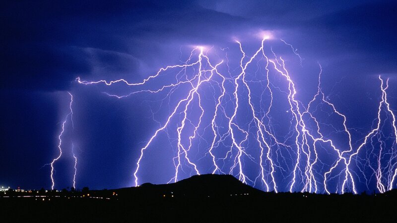 Lightning storm over hills