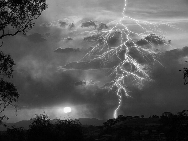 Lightning storm over hills