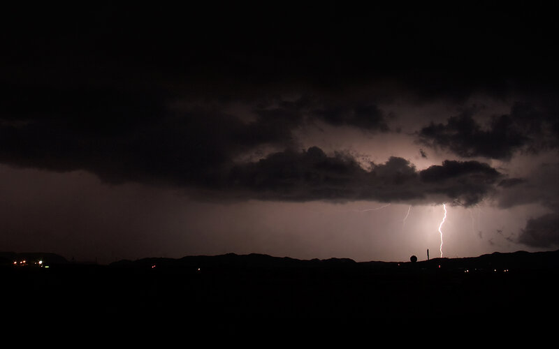 Lightning storm over hills