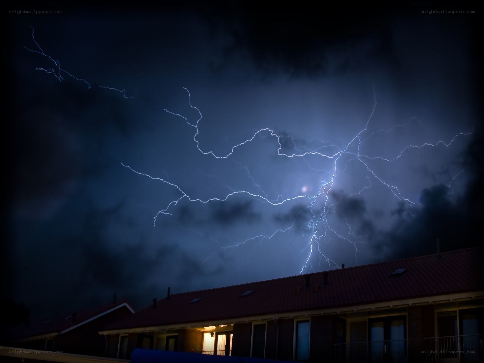 Lightning storm over houses