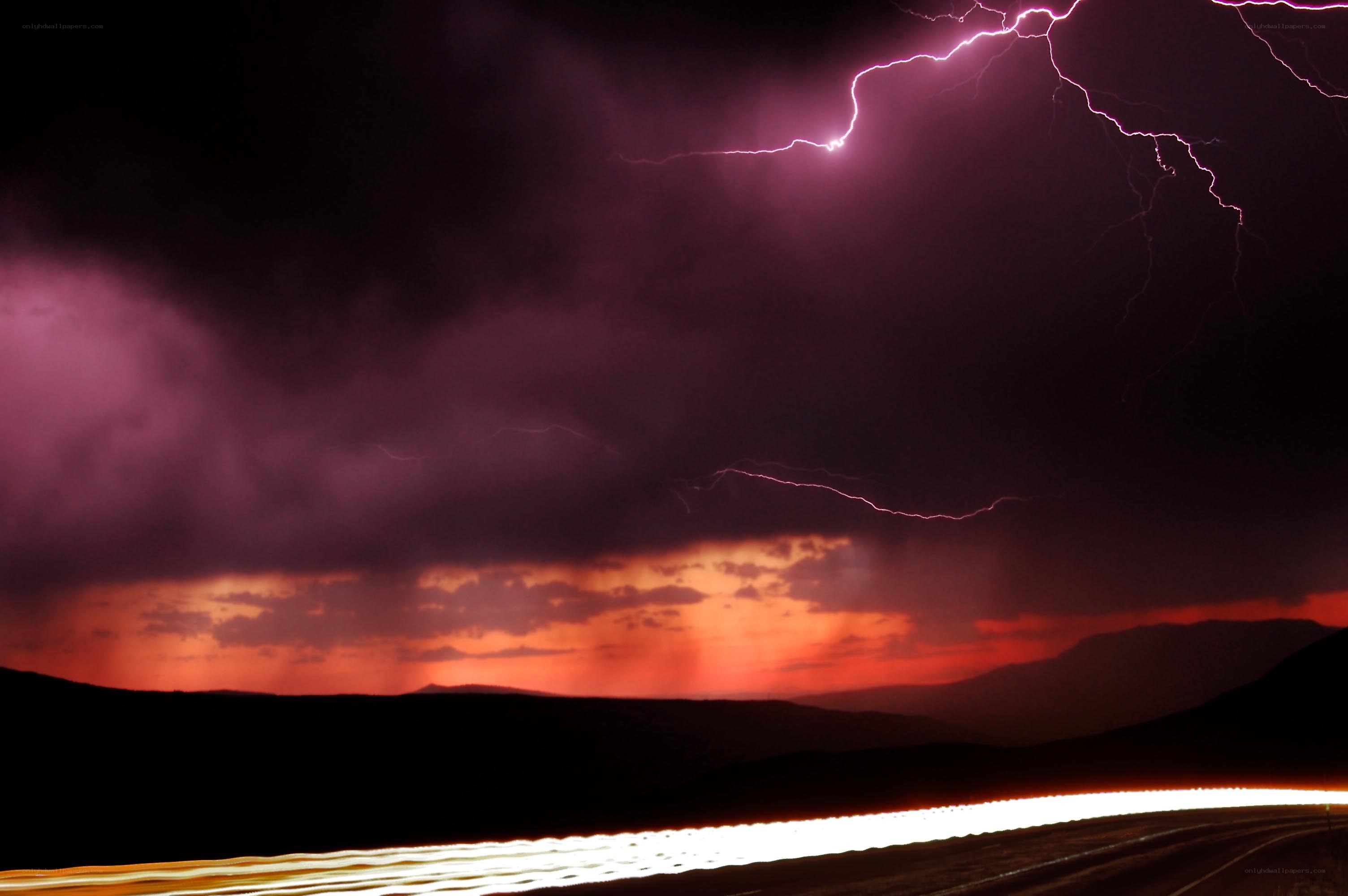 Lightning storm over mountain road