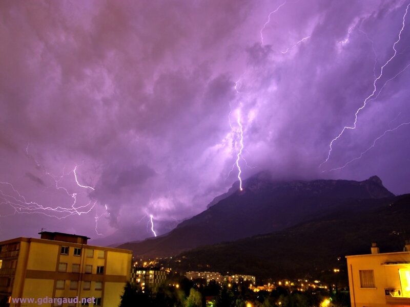 Lightning storm over mountain town