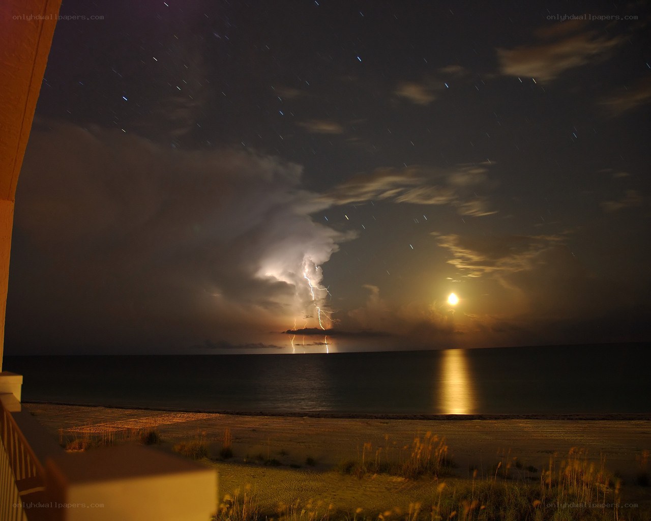 Lightning storm over ocean at night