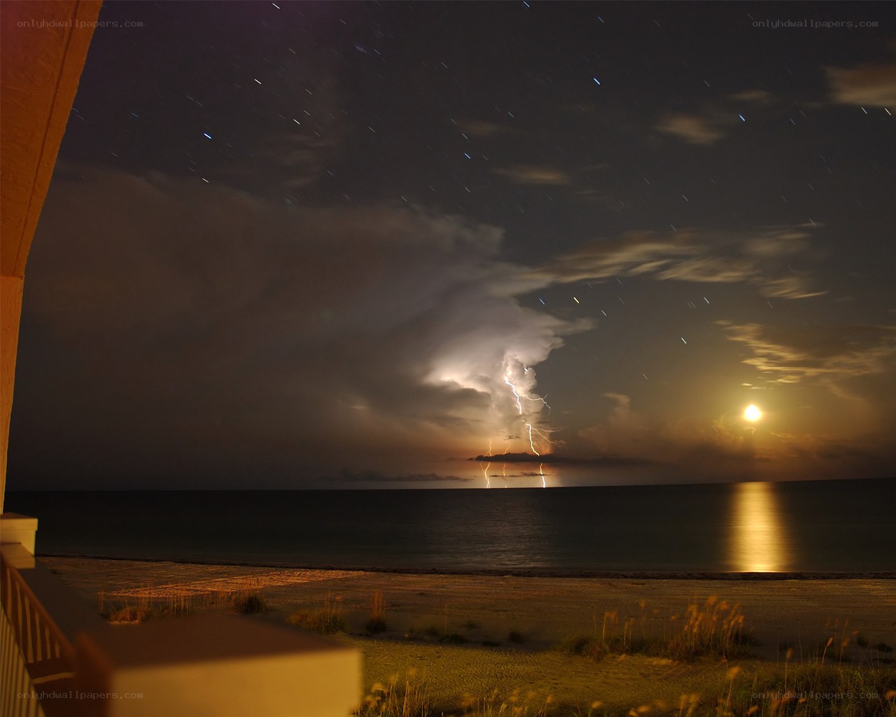 Lightning storm over ocean at night