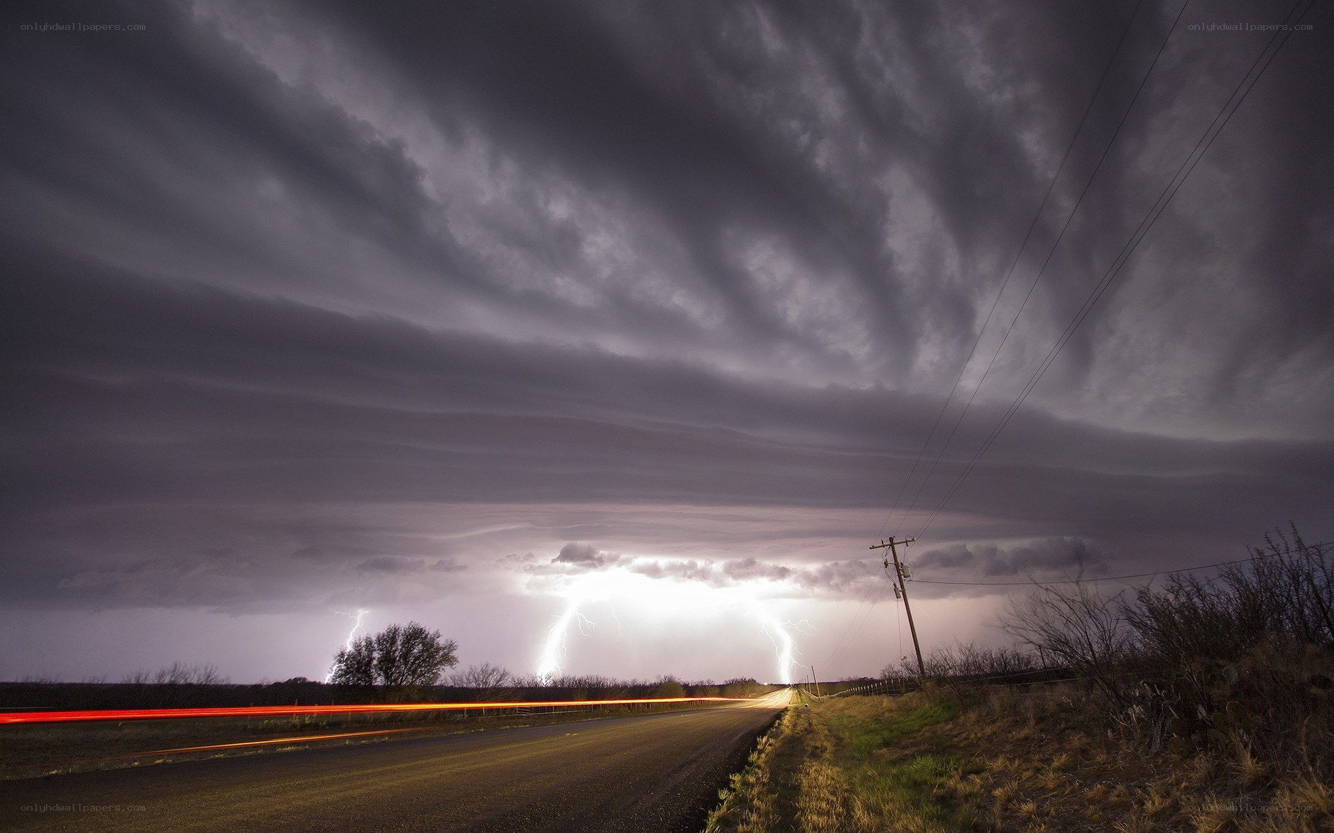 Lightning storm over rural road