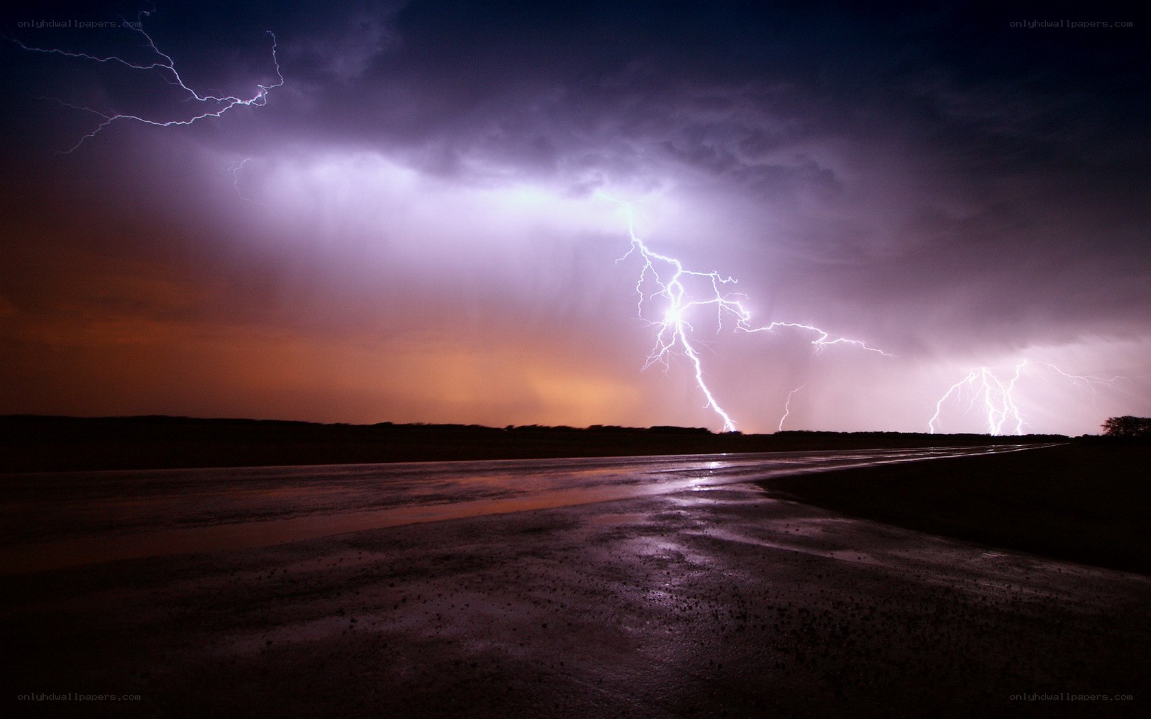Lightning storm over wet road