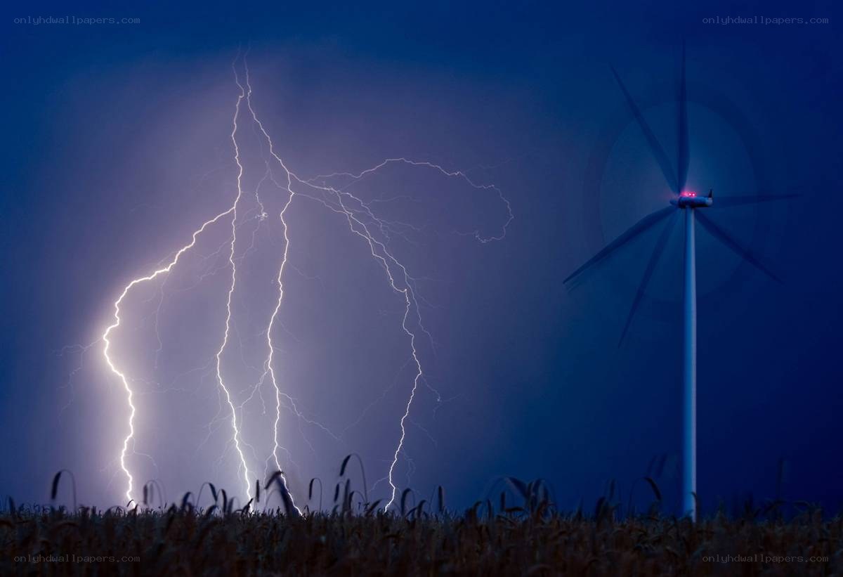 Lightning storm over wind turbine