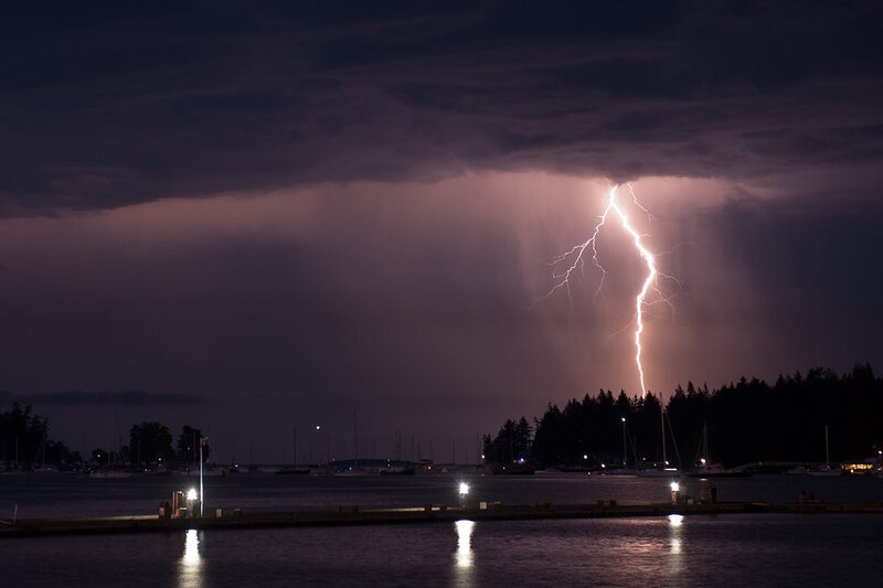 Lightning strike over a harbor