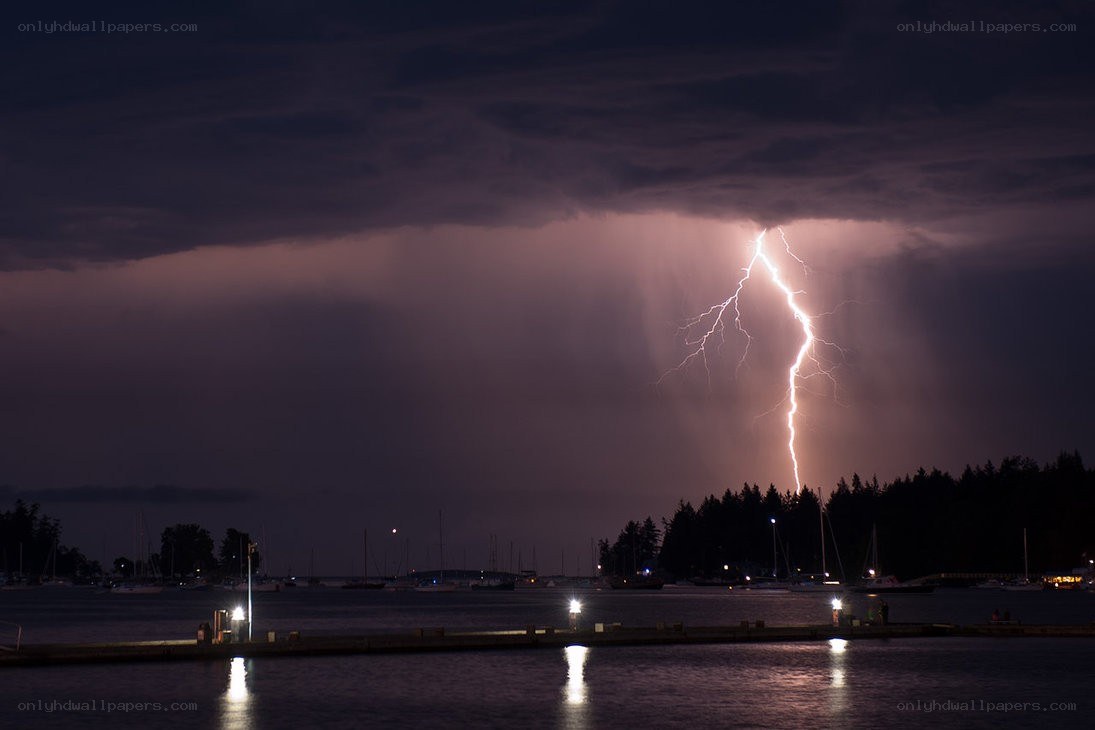 Lightning strike over a harbor