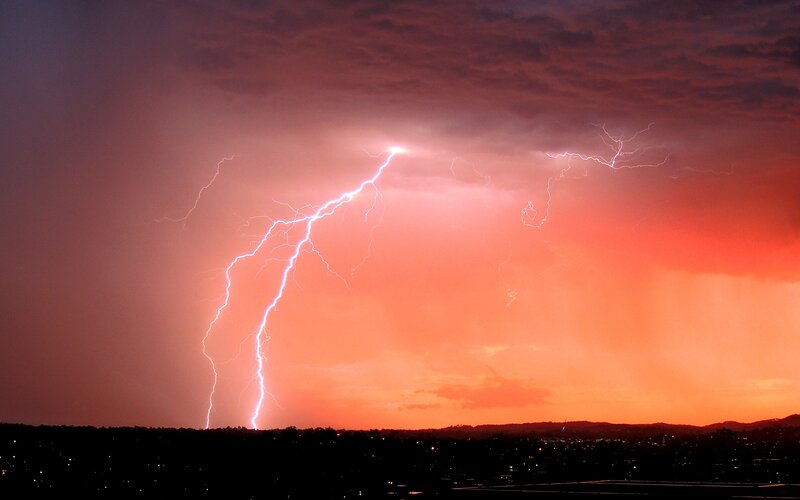 Lightning Strike over City — Orange, Dramatic