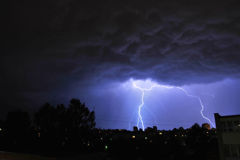 Lightning Strike over City — Purple