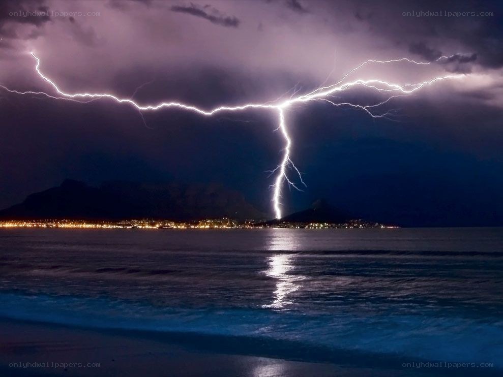 Lightning strike over coastal city