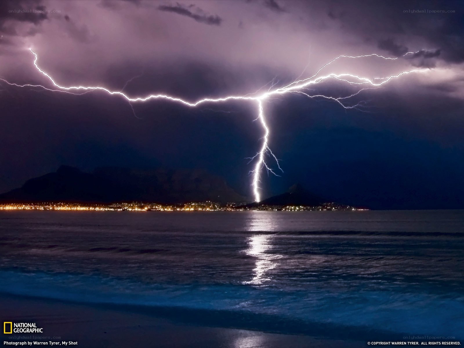 Lightning strike over coastal city